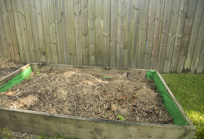 a compost pile with dead grass